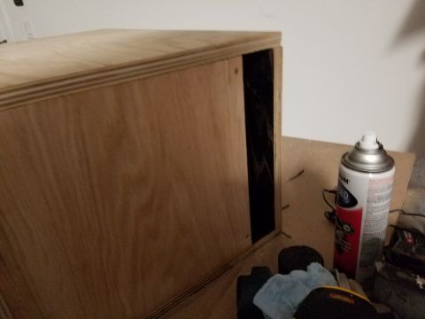 1994 Ford Bronco - Photograph of a plywood speaker enclosure showing a rectangular side port opening during construction.