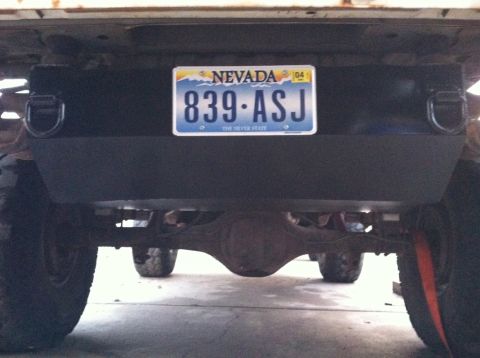 1984 Ford Bronco - The rear of a vehicle is shown, with a license plate prominently displayed.