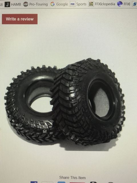 1989 Ford Bronco - Pair of off-road tires shown against a plain background.
