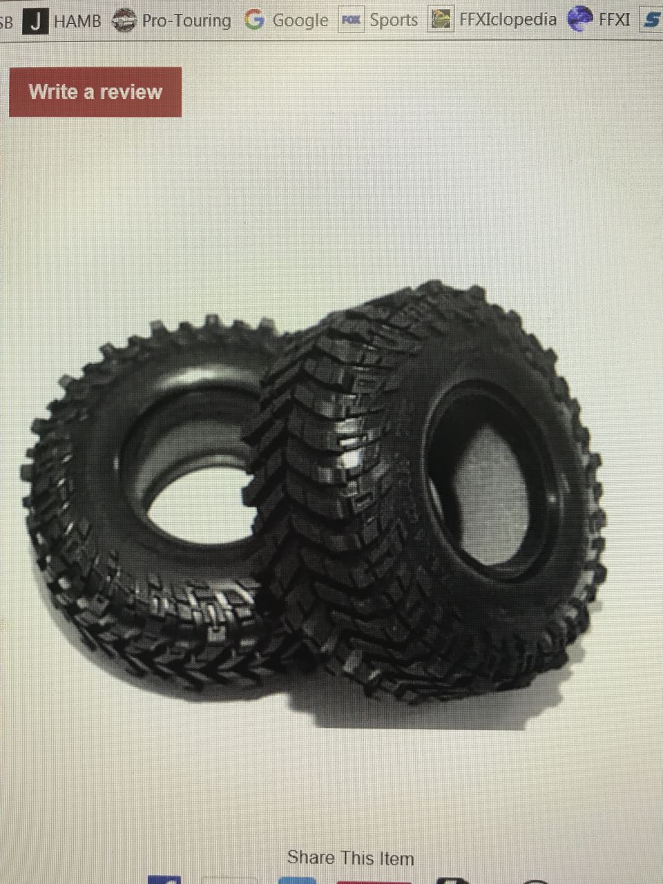 Two off-road tires with aggressive tread patterns