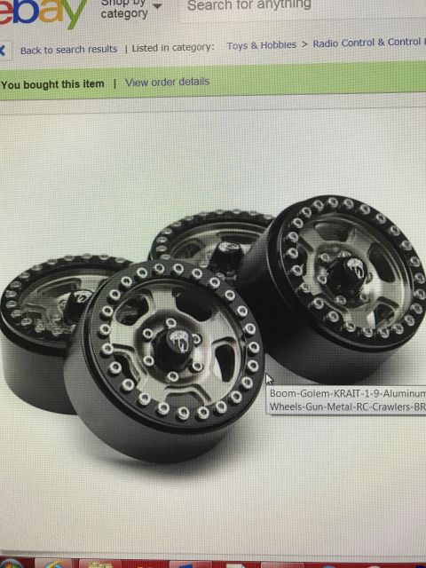 1989 Ford Bronco - Four black and silver RC crawler wheels are displayed, with text indicating they are aluminum wheels for RC crawlers.