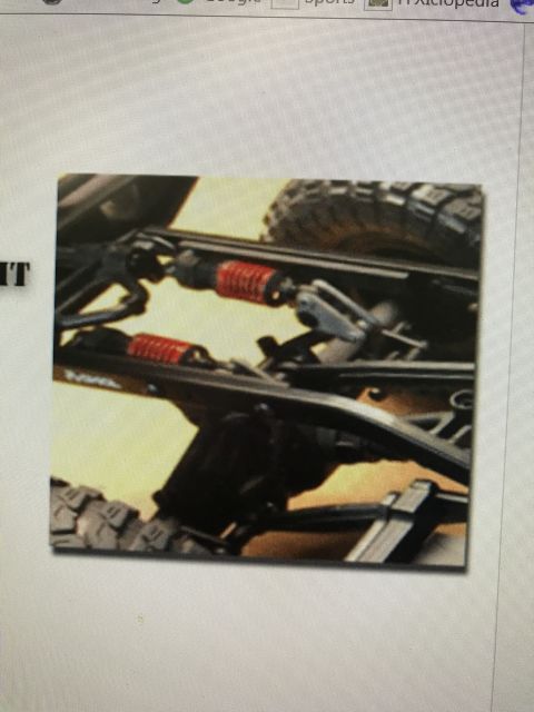 1989 Ford Bronco - Close-up view of a vehicle's suspension system, showing shocks and frame components.