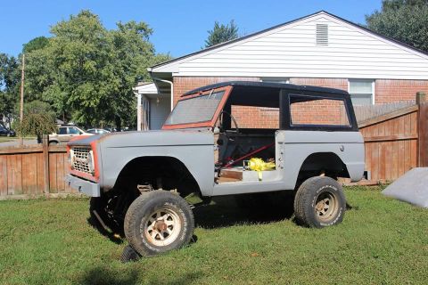 1966 Ford Bronco - This 1966 Ford Bronco is undergoing restoration, with its doors removed and body primed gray.