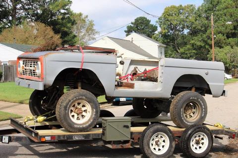 1966 Ford Bronco - This 1966 Ford Bronco body is being transported on a trailer, showing its primer gray finish and removed doors.