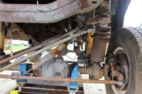 1966 Ford Bronco - Undercarriage view of a 1966 Ford Bronco, showing suspension, differential, and tire.