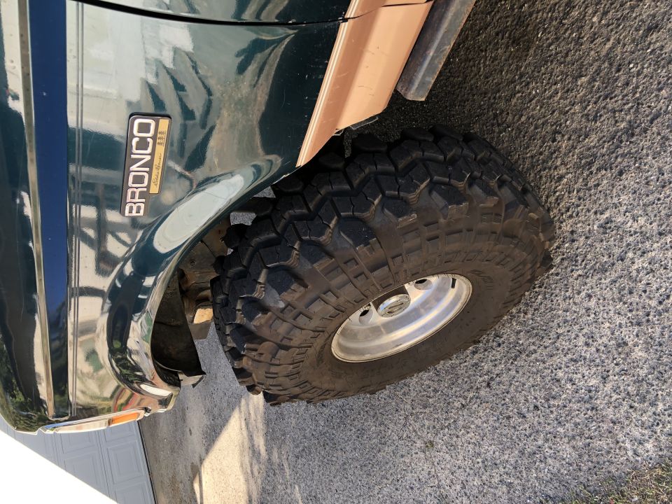 1994 Ford Bronco fender with 'BRONCO' badge and large off-road tire