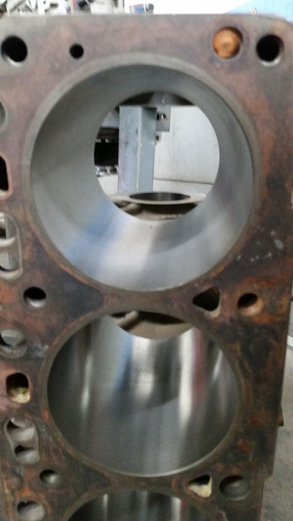 Close-up of an engine cylinder block showing two cylinder bores