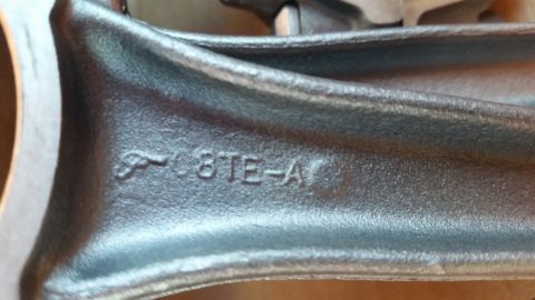 1981 Ford Bronco - A metal engine part with stamped lettering is shown in detail.