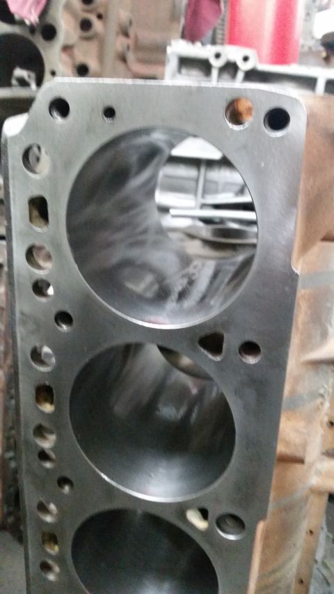 1981 Ford Bronco - Close-up of an engine block's cylinders, revealing the machined internal surfaces.