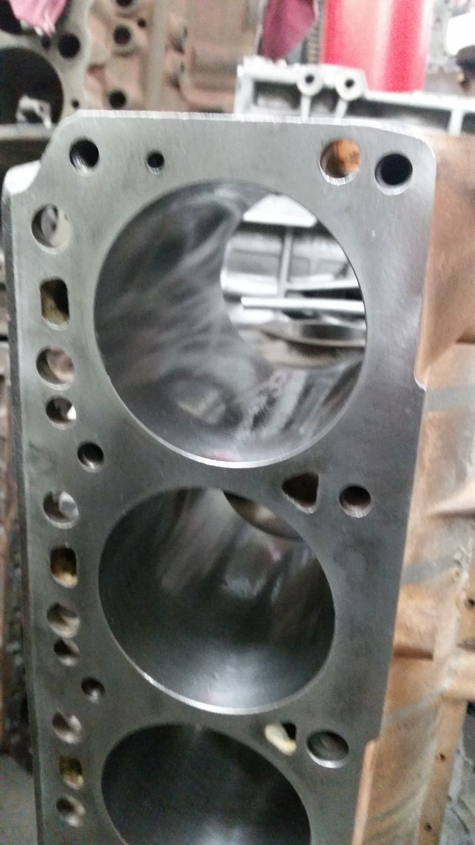 Engine block with two visible cylinders, showing machined bores