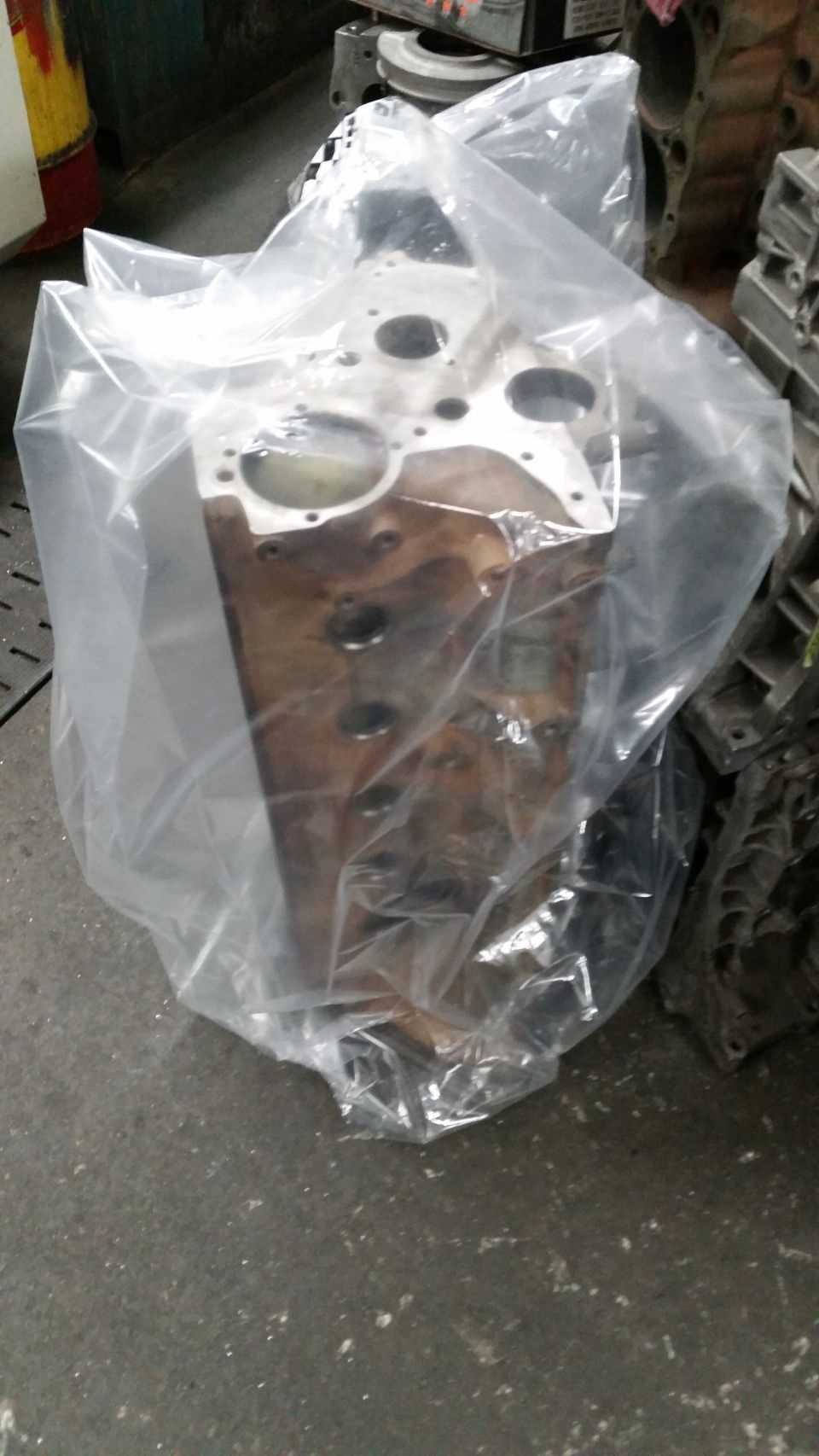 Engine block covered in plastic wrap