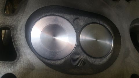 1981 Ford Bronco - Close-up of a cylinder head showing the intake and exhaust valve ports.