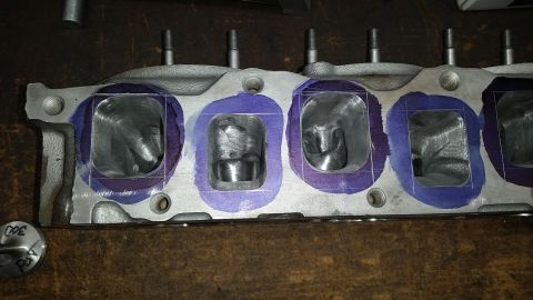 1981 Ford Bronco - Engine cylinder head prepared for porting work, showing marked intake ports.