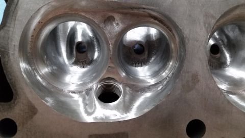 1981 Ford Bronco - Close-up view of a cylinder head, showing the intake and exhaust ports. The registry claims this is a 1981 Ford Bronco, but this is incorre…