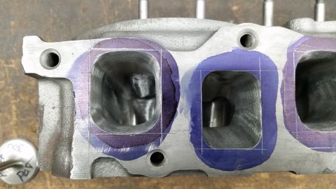 1981 Ford Bronco - Cylinder head intake ports marked for modification, showing the internal structure.
