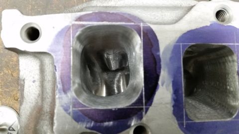 1981 Ford Bronco - Machined cylinder head ports show evidence of porting work, with purple marking compound visible.