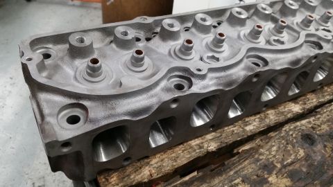 1981 Ford Bronco - Close-up view of an engine cylinder head, showing the intake ports and valve stems.