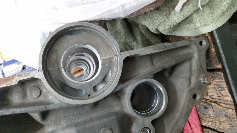 Cracked metal bearing cap assembly on engine block