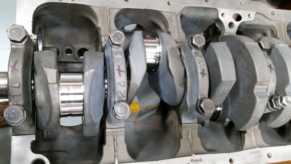 Engine block with crankshaft and connecting rods installed.