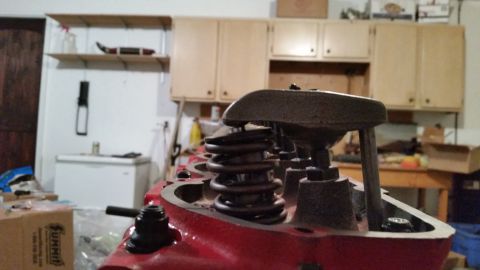 1981 Ford Bronco - Close-up view of the internal components of a red engine block, likely a V8, with valve springs and rocker arms visible. The engine appears…