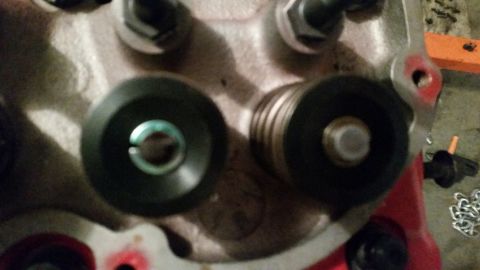 1981 Ford Bronco - A close-up view of two valve springs and retainers on an engine cylinder head. The engine appears to be a V8 with a red painted engine bloc…