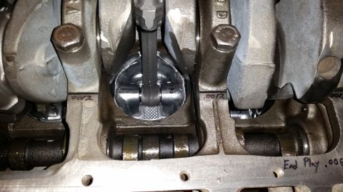 1981 Ford Bronco - Close-up view of the crankshaft, connecting rod, and piston assembly within an engine block. Markings on the engine block indicate measurem…