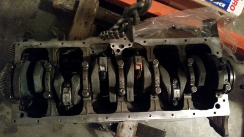 1981 Ford Bronco - Engine block assembly with crankshaft and connecting rods, ready for further work.