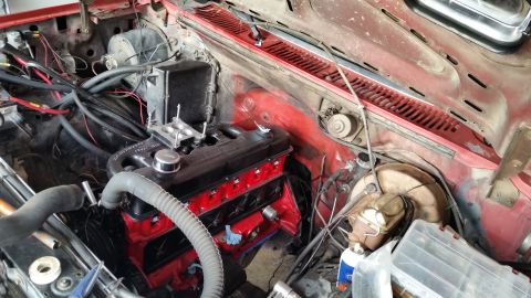 1981 Ford Bronco - V8 engine installed in a vehicle's engine bay, a carburetor and intake manifold.