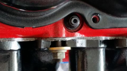 1981 Ford Bronco - Close-up view of an engine component, showing a hex bolt and washer detail.