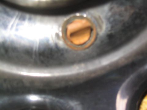 1996 Ford F-150 - A close-up view of a vehicle's wheel hub, showing a circular opening with visible rust.