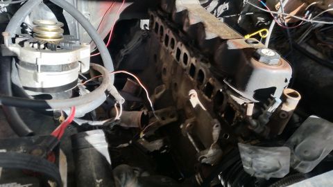 1981 Ford Bronco - Close-up view of an engine bay, showing the alternator and part of the engine block.