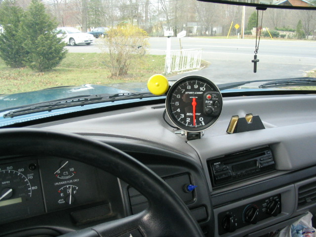 Interior view of 1996 Ford F-150 dashboard with tachometer and radio