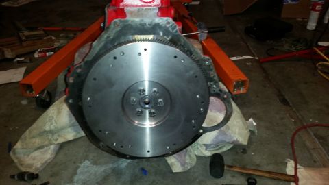 1981 Ford Bronco - Engine block and flywheel assembly on an engine stand, ready for installation or repair.