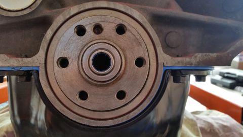1981 Ford Bronco - Close-up of an engine's crankshaft seal area, showing the housing and gasket.