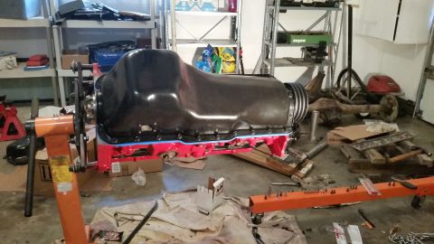 1981 Ford Bronco - Engine block assembly on an engine stand in a workshop environment.