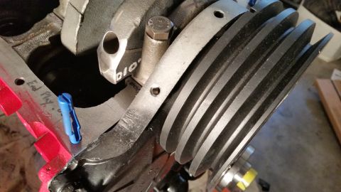 1981 Ford Bronco - A close-up view of an engine's crankshaft pulley and surrounding components, with some handwritten notes visible.