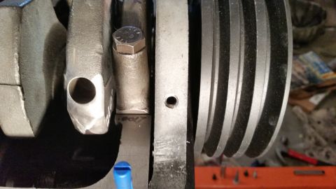 1981 Ford Bronco - Close-up view of an engine's internal components, including the crankshaft and pulley.