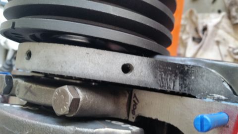 1981 Ford Bronco - Engine part detail showing a pulley and connecting rod assembly with handwritten markings.