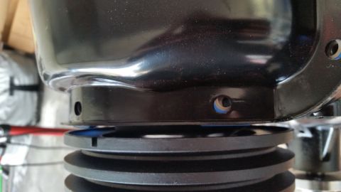 1981 Ford Bronco - Close-up of a black engine pulley system, with 'SUPERMOTORS' visible at the bottom.