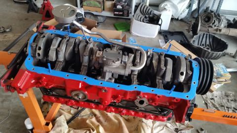 1981 Ford Bronco - Engine block assembly on an engine stand, showing crankshaft and connecting rods.