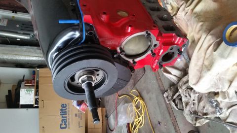 1981 Ford Bronco - Engine block and crankshaft pulley assembly, possibly undergoing rebuild or restoration.