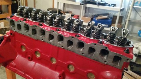 1981 Ford Bronco - Close-up of a red engine block and cylinder head assembly, showing valve train components.
