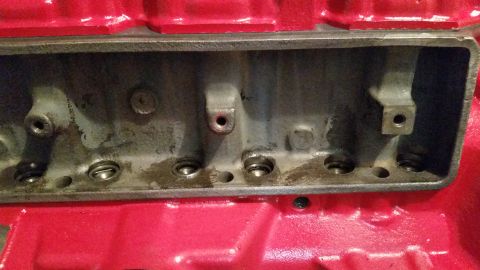 1981 Ford Bronco - Close-up view of an engine block's intake manifold area, showing ports and internal components.