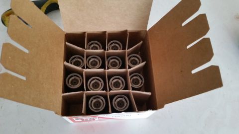 1981 Ford Bronco - A box containing multiple spark plugs is shown, with some text visible on the packaging.