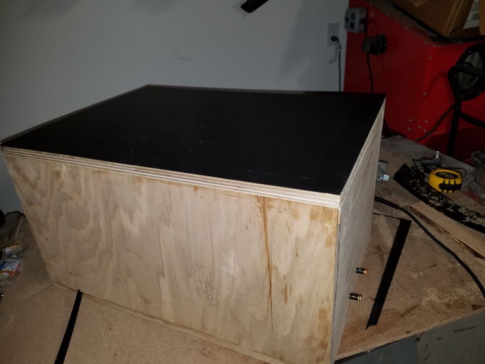 Unfinished wooden box with black top and brass fittings