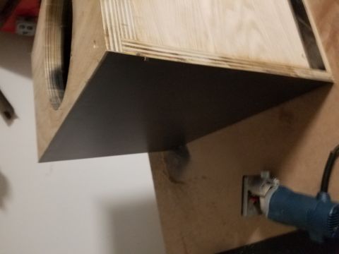 1994 Ford Bronco - Custom wooden speaker enclosure with a black baffle and a visible power tool attachment.