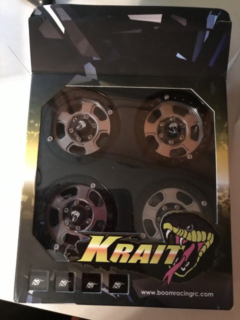 1989 Ford Bronco - Boxed RC car wheels display a snake logo and website address.