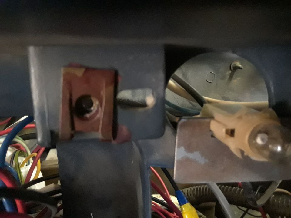 Interior wiring and light bulb socket with Supermotors.net watermark