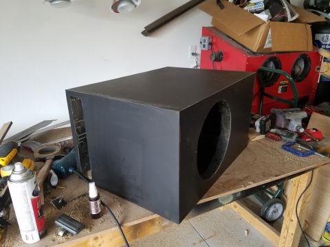 1994 Ford Bronco - Photograph of a finished ported subwoofer enclosure on a bench, not a technical document.