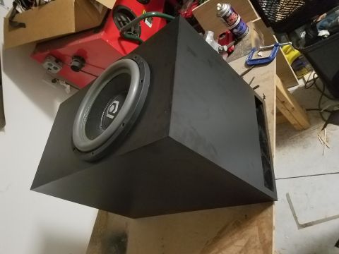 1994 Ford Bronco - Photograph of a subwoofer installed in a black box, not a technical document.
